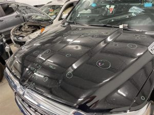 What is hail damage and how does it affect my vehicle’s paint?